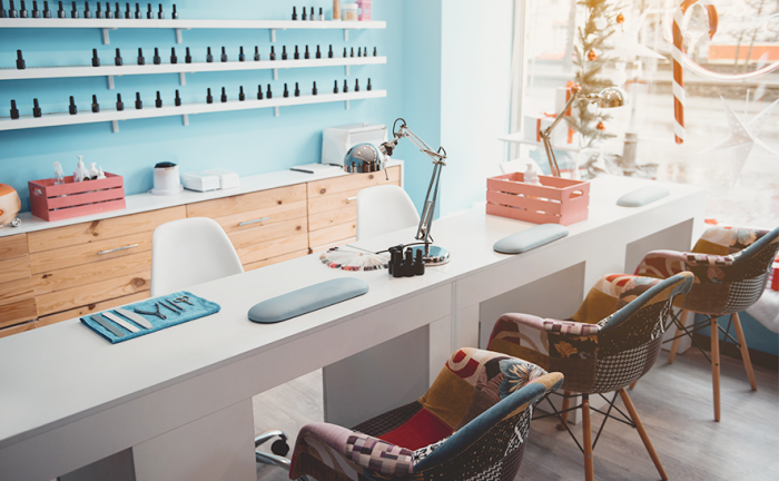 empty stations and chairs at a nail salon