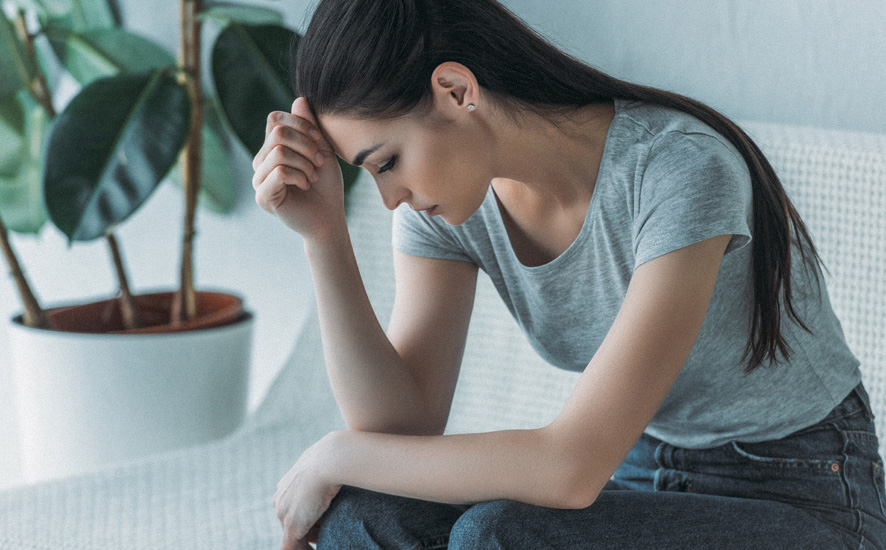 tired woman with a facepalm