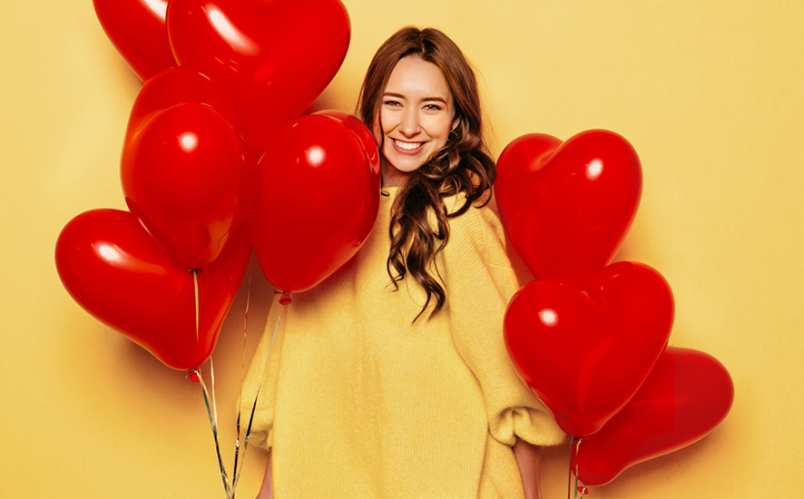 woman with heart-shaped baloons
